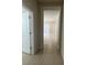 Hallway with access to a large living room at 1892 Spring Shower Cir, Kissimmee, FL 34744