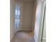 Hallway with access to a glass door at 1892 Spring Shower Cir, Kissimmee, FL 34744