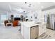 Open-concept kitchen flowing into the living area, showcasing a large island and stainless steel appliances at 1930 Molise Dr, Poinciana, FL 34759