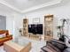 Cozy living room showcases stylish decor, decorative shelving, and modern tile flooring at 1930 Molise Dr, Poinciana, FL 34759