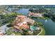 Expansive aerial view of the community with beautiful lakes, lush landscaping, and a sparkling pool area at 196 Knoll Wood Dr, Kissimmee, FL 34759