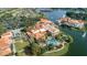 Aerial view of Solivita showcasing the lake, pool, and the community's resort-style amenities at 196 Knoll Wood Dr, Kissimmee, FL 34759