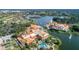 Aerial view of Solivita showcasing the lake, pool, and the community's resort-style amenities at 196 Knoll Wood Dr, Kissimmee, FL 34759