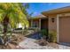 Exterior featuring stone walkway and covered front porch at 196 Knoll Wood Dr, Kissimmee, FL 34759