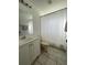 Bathroom featuring a vanity with storage and tiled floors at 2408 Cedarfield Ln, Kissimmee, FL 34744