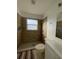 Bathroom featuring tiled shower with a neutral color scheme at 2408 Cedarfield Ln, Kissimmee, FL 34744