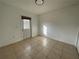 Bedroom featuring tiled flooring and a door to the exterior at 2408 Cedarfield Ln, Kissimmee, FL 34744