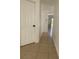 Hallway featuring tile flooring and white walls at 2408 Cedarfield Ln, Kissimmee, FL 34744