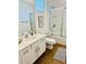 Bright bathroom featuring a shower over tub, sink, and ceramic floors at 2641 Calistoga Ave, Kissimmee, FL 34741