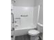 Accessible bathroom featuring a white tub-shower combo and safety grab bars at 3216 Fieldcrest Ter, Deltona, FL 32725