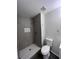 Newly renovated bathroom features stylish tiled shower, modern fixtures and neutral decor at 3216 Fieldcrest Ter, Deltona, FL 32725