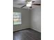 Light-filled bedroom with ceiling fan and large window overlooking the backyard at 3216 Fieldcrest Ter, Deltona, FL 32725