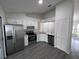 Modern kitchen with stainless steel appliances, granite countertops and ample cabinet space at 3216 Fieldcrest Ter, Deltona, FL 32725