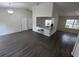 Bright and airy living room with a partial view of the kitchen and modern bar stool seating at 3216 Fieldcrest Ter, Deltona, FL 32725