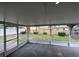 Enclosed patio with views of the fenced yard and green space, perfect for outdoor entertaining at 3216 Fieldcrest Ter, Deltona, FL 32725