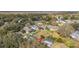 Aerial view showcasing the property's screened-in pool and the surrounding neighborhood at 336 California Blvd, Davenport, FL 33897