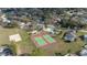 Aerial shot showcasing tennis and volleyball courts, playground, and community pool at 336 California Blvd, Davenport, FL 33897