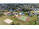 Overhead view showcasing tennis courts, volleyball court, playground, and pool in the neighborhood at 336 California Blvd, Davenport, FL 33897