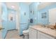 Sky blue bathroom offers a single sink vanity and a tub/shower combo at 336 California Blvd, Davenport, FL 33897