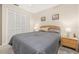 Carpeted bedroom with neutral walls and double door closet at 336 California Blvd, Davenport, FL 33897