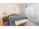 A cozy bedroom features carpet, neutral paint, and natural light from a window at 336 California Blvd, Davenport, FL 33897