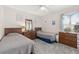 Cozy bedroom featuring twin beds, wooden dressers, and a ceiling fan at 336 California Blvd, Davenport, FL 33897