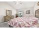 Bright bedroom with a large window, a neutral color scheme, and soft carpeting creates a serene space at 336 California Blvd, Davenport, FL 33897