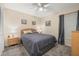 Carpeted bedroom featuring a ceiling fan and neutral paint at 336 California Blvd, Davenport, FL 33897