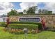 Well-manicured entrance sign for The Manors at Westridge with stone wall and lush landscaping at 336 California Blvd, Davenport, FL 33897