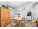 Well-lit dining room with wood floors, a tile-top table, and decorative accents at 336 California Blvd, Davenport, FL 33897