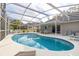 Sparkling screened-in pool with plenty of space for lounging and enjoying the Florida sunshine at 336 California Blvd, Davenport, FL 33897