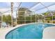 Inviting screened-in pool area with lounge chairs, perfect for outdoor relaxation at 336 California Blvd, Davenport, FL 33897