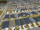 Aerial shot of closely built homes in a Gathering-friendly neighborhood, featuring backyard spaces and organized street layout at 3930 Palazzo Pl, Winter Haven, FL 33884