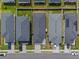 Birds-eye view of modern homes, featuring neat landscaping, driveways, and a glimpse of neighborhood design with solar panels at 3930 Palazzo Pl, Winter Haven, FL 33884