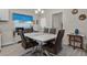 Bright dining room with a white table, modern chairs, and elegant decor at 3930 Palazzo Pl, Winter Haven, FL 33884