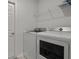 Laundry room featuring a washer, dryer, and shelving at 3930 Palazzo Pl, Winter Haven, FL 33884