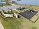 Aerial view of community playground and sign surrounded by lush landscaping at 3930 Palazzo Pl, Winter Haven, FL 33884