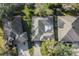 Overhead view of a single Gathering home with a screened-in pool area, surrounded by lush landscaping at 4086 Kingsley St, Clermont, FL 34711