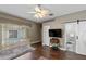 This bedroom provides access to the backyard pool through sliding glass doors and en-suite bathroom at 4086 Kingsley St, Clermont, FL 34711