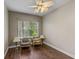 Cozy bedroom showcasing wood floors, a ceiling fan, and plenty of natural light at 4086 Kingsley St, Clermont, FL 34711