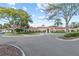 Community clubhouse with palm trees and well-maintained landscaping on a sunny day at 4086 Kingsley St, Clermont, FL 34711