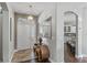 Bright entryway with tile floor and a view to the kitchen through an arched doorway at 4086 Kingsley St, Clermont, FL 34711