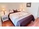 Charming bedroom with a bed, decorative pillows, side tables, and attractive lamps at 446 Davinci Pass, Poinciana, FL 34759