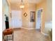 Inviting foyer with neutral paint and tile flooring at 446 Davinci Pass, Poinciana, FL 34759