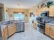 Bright eat-in kitchen with stainless appliances, tiled backsplash, and an adjacent dining area at 446 Davinci Pass, Poinciana, FL 34759