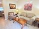 Cozy living room with neutral tones, comfortable seating, and a coffee table at 446 Davinci Pass, Poinciana, FL 34759