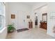 Bright foyer with tiled floor and a view into the living space at 4911 Drawdy Ct, St Cloud, FL 34772