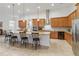 Kitchen featuring a long island with pendant lighting and stainless steel appliances at 4911 Drawdy Ct, St Cloud, FL 34772