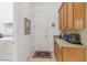 A laundry room featuring cabinets, counter space, and a utility sink at 4911 Drawdy Ct, St Cloud, FL 34772