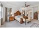 Main bedroom featuring a wooden bed frame, carpet, and neutral tones at 4911 Drawdy Ct, St Cloud, FL 34772